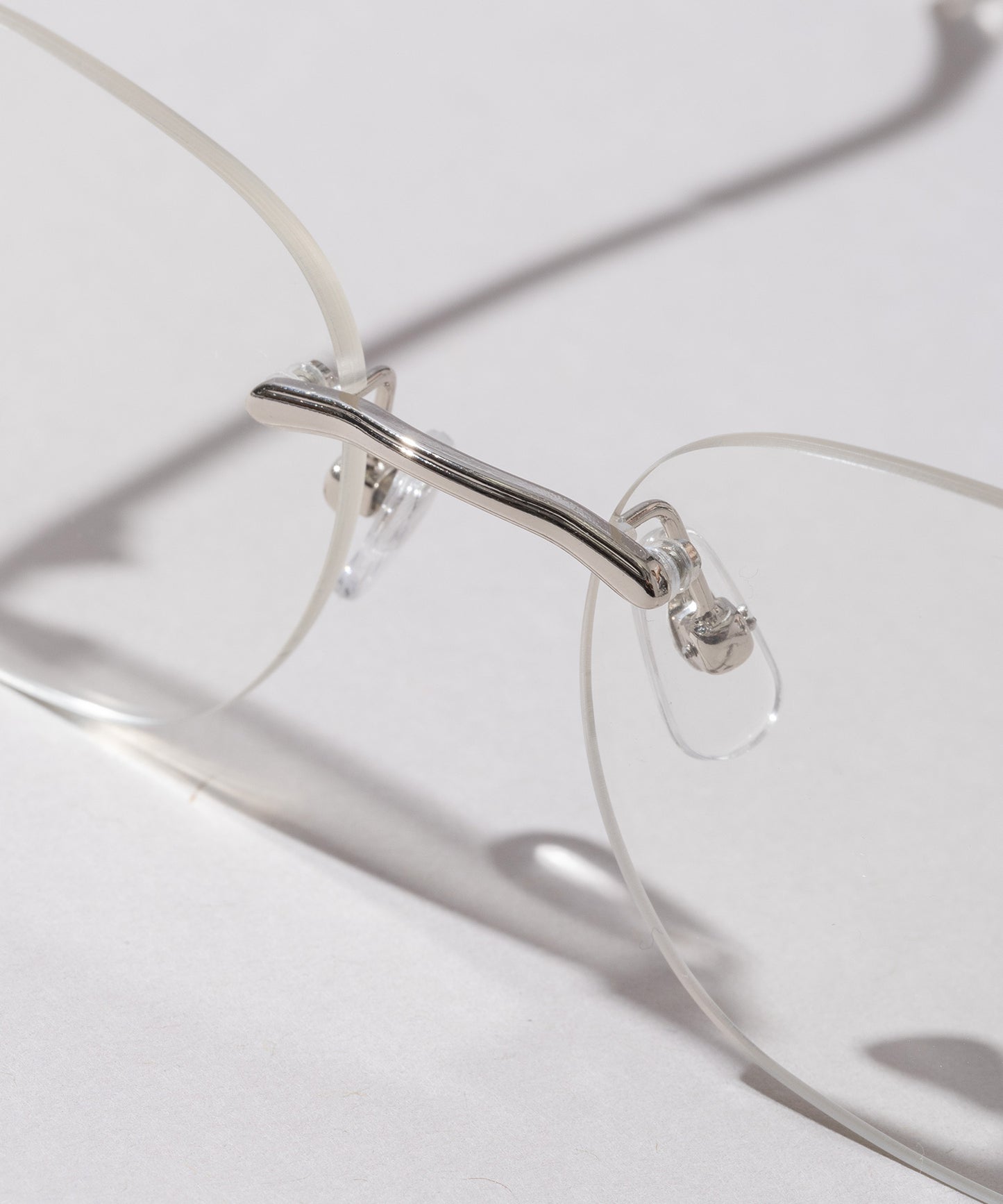 リムレススクエア伊達メガネ