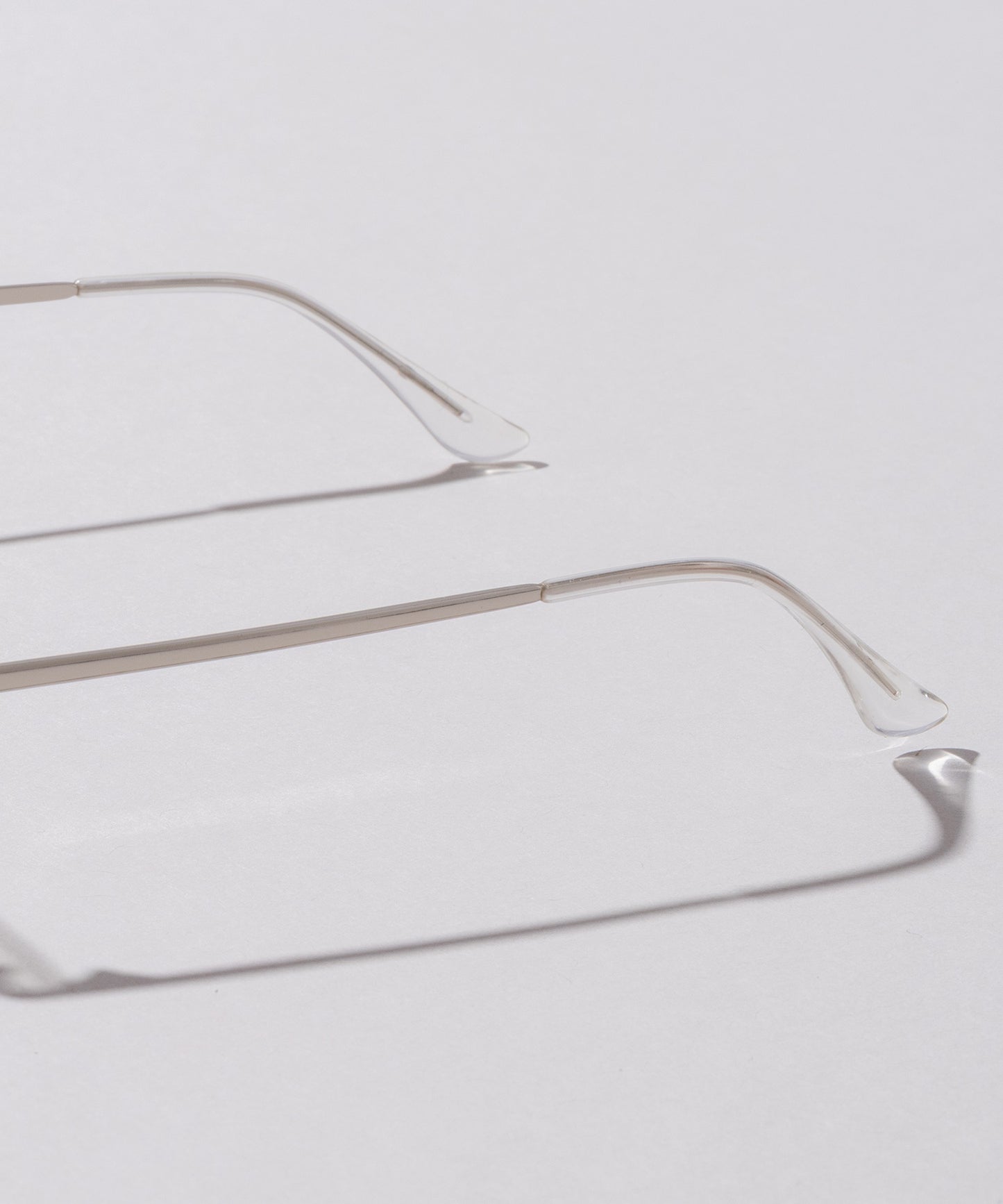 リムレススクエア伊達メガネ